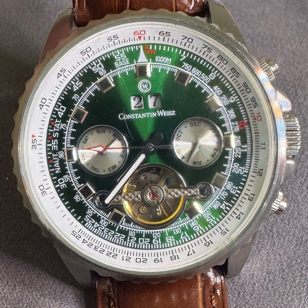 Constantine Weisz green dial automatic day / date / month with leather strap